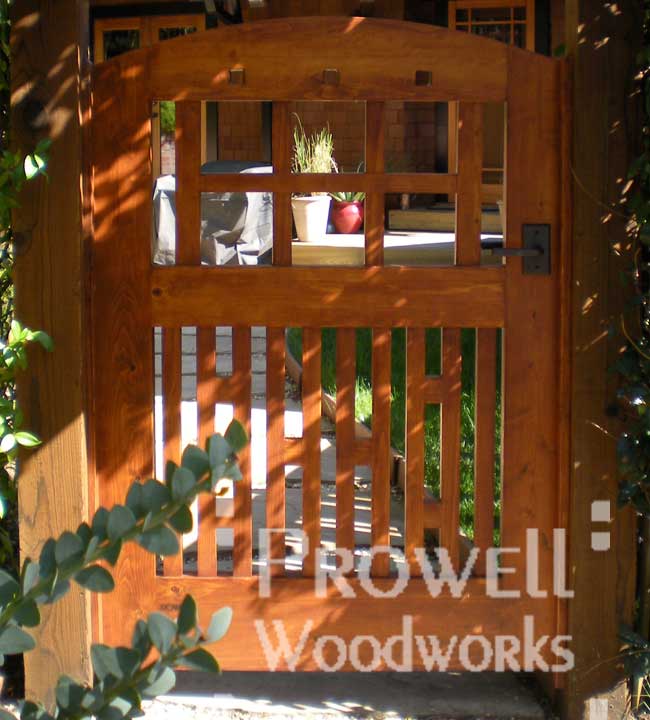 custom wood gate with bronze gate atches