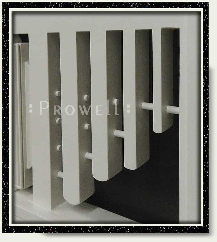 Ccropped photograph showing the receding thickness and dowel stabilizers of modern gate #208