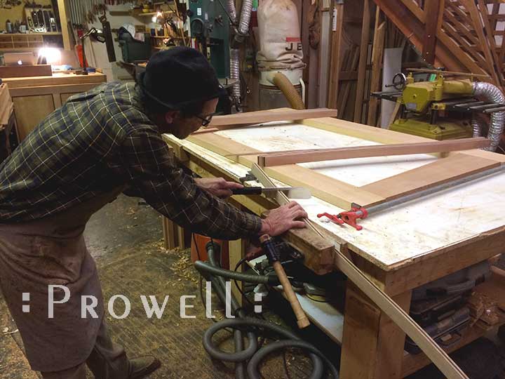 shop progress photo showing charles setting the strings to the eccentric gate design #213