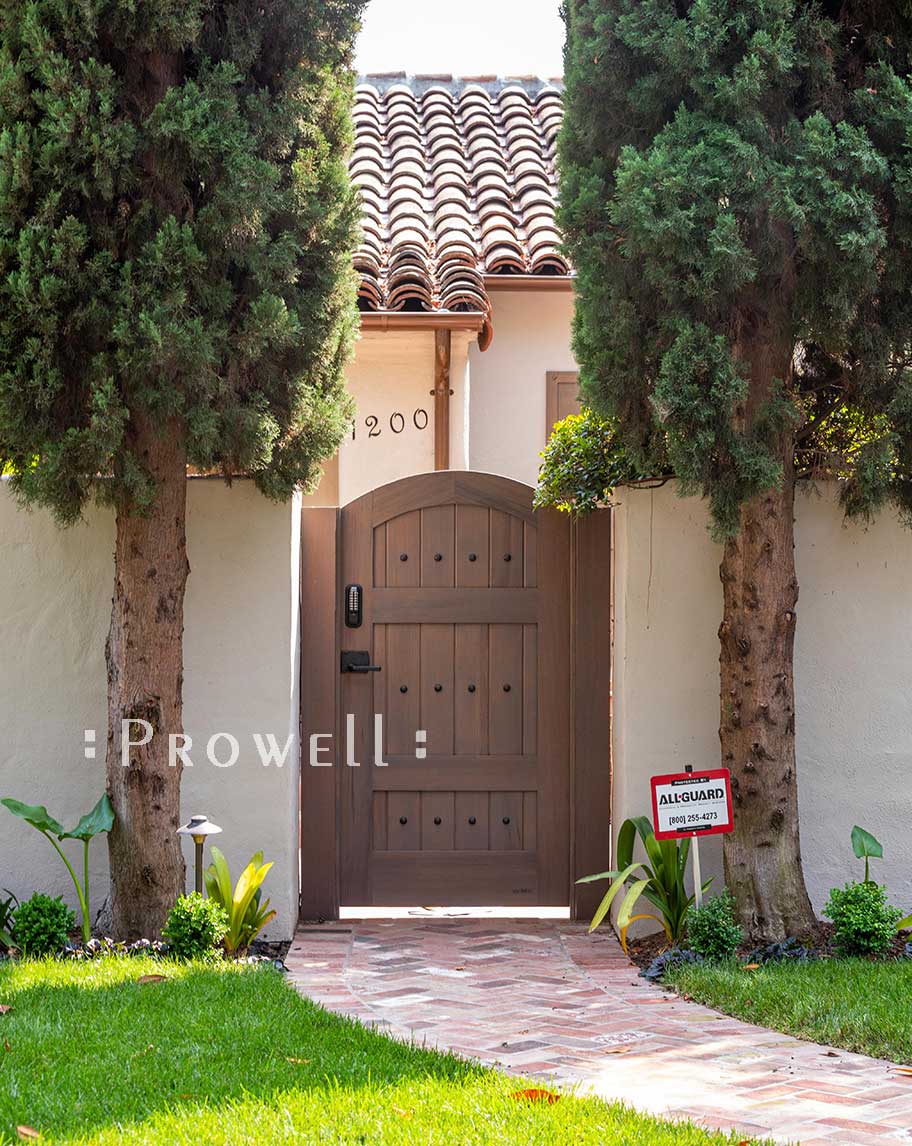 showing the arched gate between stucco pillars in Palo Alto, california