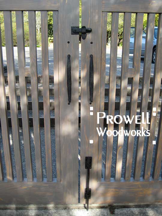 site image showing the property side of wood fence gate #38-1 with the cane bolt, gate pulls, and clasp. 
