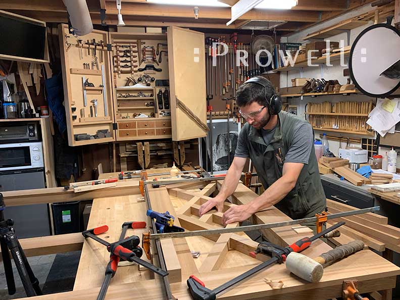 shop photo showing Ben prowell creating the upper pattern for main gate design #39
