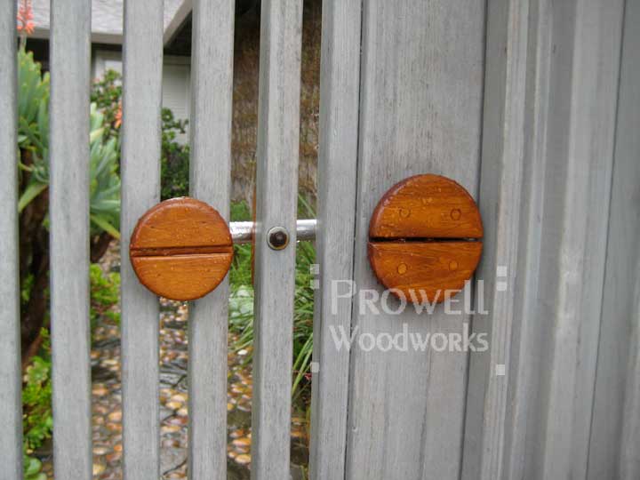site photo showing Prowell's teak and stainless steel gate latch. 