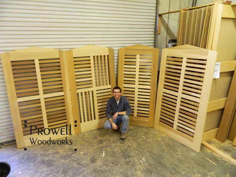 shop photo showing Ben Prowell with four wood gate designs #95
