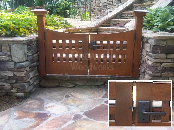 site photograph showing arched wooden gates #96-5 flanked by stone walls in Atlanta, Georgia
