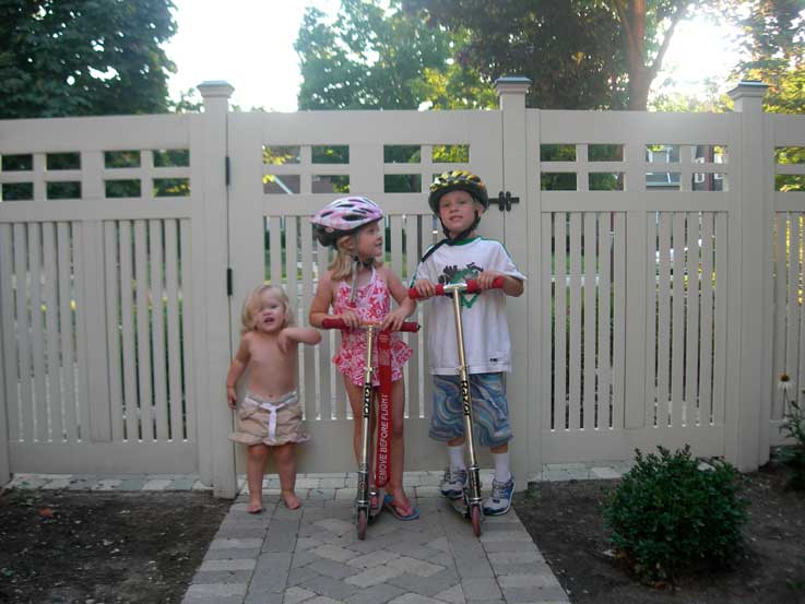 Wood garden gate with children in Chicago