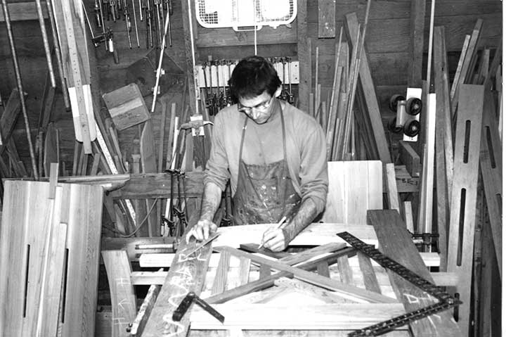 Early shop photo showing charles building the original wood garden gate #51.