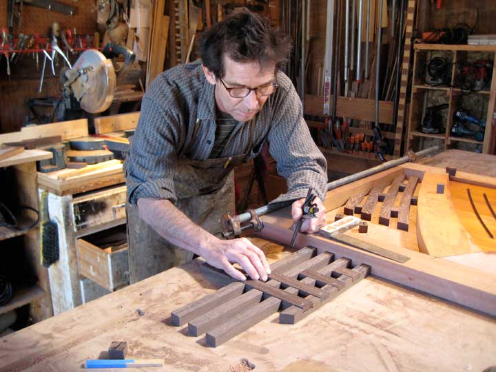 shop phptpgraph showing Charles laying out the wenge grrid for the modern gate 202