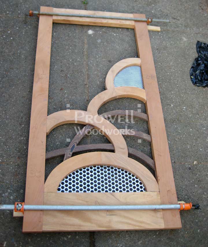 photograph showing the progress of the unusual wood gate #203