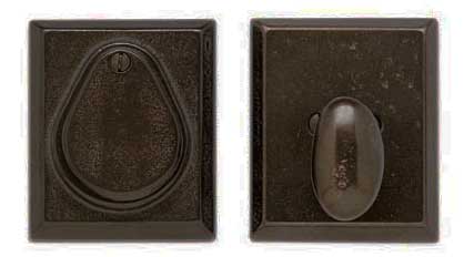 Two dark vintage light switch plates.