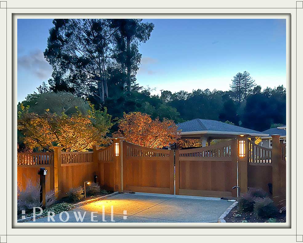 Driveway gates wooden 38e with lighted wood columns in Marin County, CA.