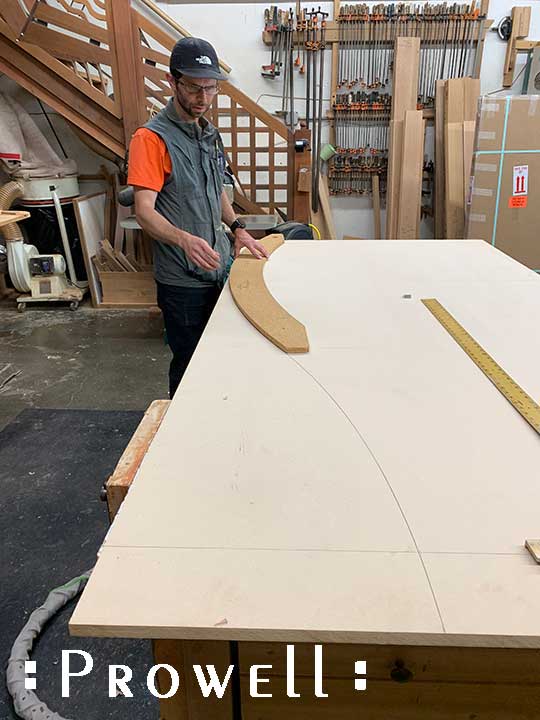Laying out a crescent arch in wood gates.