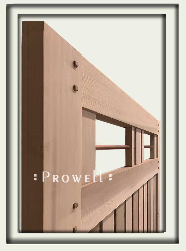 wood driveway gates with raised integrity pins.